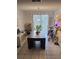 Bright dining area with plants, string lights, and modern furnishings at 645 Captiva Cir, Kissimmee, FL 34741