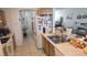 Functional kitchen featuring tile floors and stainless steel sink at 645 Captiva Cir, Kissimmee, FL 34741