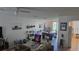 Open living space featuring tile flooring, stylish furniture, and bright natural light at 645 Captiva Cir, Kissimmee, FL 34741
