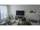 Cozy living room with a comfortable couch and modern decor at 645 Captiva Cir, Kissimmee, FL 34741