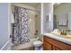 Well-lit bathroom with a shower-tub combo and a single sink vanity at 8945 Cuban Palm Rd, Kissimmee, FL 34747