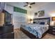 Comfortable bedroom with ceiling fan, large window, and patterned bedding at 8945 Cuban Palm Rd, Kissimmee, FL 34747