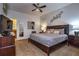 Comfortable bedroom featuring a queen-sized bed, modern décor, and ample closet space at 8945 Cuban Palm Rd, Kissimmee, FL 34747