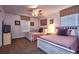 Bedroom with twin beds, ceiling fan, carpet, and framed artwork on the walls at 8945 Cuban Palm Rd, Kissimmee, FL 34747