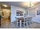 Cozy dining room featuring a wooden table with seating for six under a stylish chandelier at 8945 Cuban Palm Rd, Kissimmee, FL 34747
