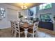 Formal dining room boasts a large table with seating for eight and abundant natural light at 8945 Cuban Palm Rd, Kissimmee, FL 34747