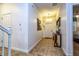 Bright foyer with tiled floor, front door and decorative table with white accents at 8945 Cuban Palm Rd, Kissimmee, FL 34747