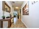 Inviting foyer featuring tile floors, decor, and an staircase at 8945 Cuban Palm Rd, Kissimmee, FL 34747
