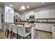 Modern kitchen with granite counters, stainless appliances, and an island with seating at 8945 Cuban Palm Rd, Kissimmee, FL 34747
