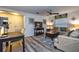 A comfortably furnished living room with a desk, sofa, and a large coffee table on a gray rug at 8945 Cuban Palm Rd, Kissimmee, FL 34747