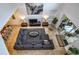 Open-concept living room featuring tile floors, sectional sofa, and dining area at 8945 Cuban Palm Rd, Kissimmee, FL 34747