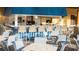 Outdoor bar area with seating and counterspace perfect for entertaining by the pool at 8945 Cuban Palm Rd, Kissimmee, FL 34747