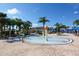 Community splash pad with colorful water features and covered lounge seating at 8945 Cuban Palm Rd, Kissimmee, FL 34747