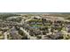 An aerial view of the community and residences, showcasing the pond and landscape at 9061 Lee Vista Blvd # 1303, Orlando, FL 32829