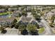 An aerial view of residences that shows parking, landscaping, and proximity to a pond at 9061 Lee Vista Blvd # 1303, Orlando, FL 32829