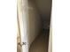 Walk-in closet featuring a high angled ceiling, a row of coat hooks, and neutral carpeting at 9061 Lee Vista Blvd # 1303, Orlando, FL 32829