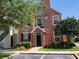 Attractive three-story building with a covered entryway, multiple windows, and tidy landscaping at 9061 Lee Vista Blvd # 1303, Orlando, FL 32829
