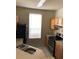 Bright kitchen featuring tile flooring, neutral countertops, and wood cabinetry at 9061 Lee Vista Blvd # 1303, Orlando, FL 32829