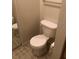Cozy bathroom features a standard white toilet with a tiled floor at 9061 Lee Vista Blvd # 1303, Orlando, FL 32829