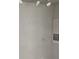 Clean walls with ceiling-mounted track lighting and a wall-mounted vent at 9061 Lee Vista Blvd # 1303, Orlando, FL 32829