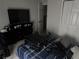 Bedroom with a dresser and tv, and a suitcase laying on the bed at 10197 Ridgebloom Ave, Orlando, FL 32829