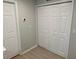Bedroom featuring a bifold closet door and wood-look flooring at 10197 Ridgebloom Ave, Orlando, FL 32829