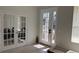 Bright living room featuring a glass-paned door leading to the outside at 10197 Ridgebloom Ave, Orlando, FL 32829