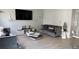 Modern living room with stylish furniture, a large TV, and contemporary decor at 10197 Ridgebloom Ave, Orlando, FL 32829