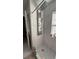 Modern shower featuring decorative tile and a shower head at 10197 Ridgebloom Ave, Orlando, FL 32829