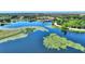 Stunning aerial view of a community lake featuring lush vegetation, a community pool, and beautiful surroundings at 104 La Cresta Ct, Davenport, FL 33837
