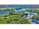 Gorgeous aerial view of home on a spacious lot near lake and golf course in a scenic community at 104 La Cresta Ct, Davenport, FL 33837