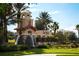 Beautiful community entrance with a water feature, lush landscaping, and welcoming signage at 104 La Cresta Ct, Davenport, FL 33837
