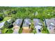Beautiful exterior of single-Gathering homes featuring well-manicured lawns and brick-paved driveways at 104 La Cresta Ct, Davenport, FL 33837