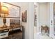 Inviting foyer featuring neutral wall paint, tiled floors, a decorative console table and a glass-paneled front door at 104 La Cresta Ct, Davenport, FL 33837