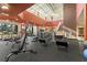 Spacious gym with modern exercise equipment, natural light, and a dedicated weight training area at 104 La Cresta Ct, Davenport, FL 33837