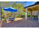 Enclosed patio featuring brick flooring, outdoor furniture and ceiling fan, offering a relaxing outdoor living space at 104 La Cresta Ct, Davenport, FL 33837