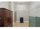 Spacious walk-in closet with wire shelving, wood-look floors, and ample storage space at 104 La Cresta Ct, Davenport, FL 33837