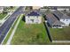 Aerial view of the home with solar panels and a spacious yard within a residential community at 1246 Maplebrook Dr, Lake Alfred, FL 33850