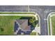 Aerial view of a home showcasing solar panels, landscaping, and a convenient location in a quiet neighborhood at 1246 Maplebrook Dr, Lake Alfred, FL 33850