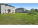 Spacious backyard featuring lush green lawn, a privacy fence, and ample room for outdoor activities at 1246 Maplebrook Dr, Lake Alfred, FL 33850