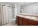 Bathroom featuring dual sinks, vanity, and a shower/tub combo at 1246 Maplebrook Dr, Lake Alfred, FL 33850