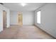 Spacious bedroom with soft carpet, bright lighting and ensuite bathroom access at 1246 Maplebrook Dr, Lake Alfred, FL 33850