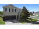 Inviting two-story home featuring a lush tree-lined front yard and a convenient two-car garage at 1246 Maplebrook Dr, Lake Alfred, FL 33850
