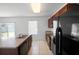 Kitchen boasting wood cabinets, matching appliances, and a stainless steel dual basin sink at 1246 Maplebrook Dr, Lake Alfred, FL 33850