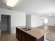 Bright kitchen features wood cabinets, neutral counters, tile floors, and stainless steel dual basin sink at 1246 Maplebrook Dr, Lake Alfred, FL 33850
