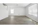 Bright living room featuring sleek floors and natural light through modern window blinds at 1246 Maplebrook Dr, Lake Alfred, FL 33850