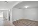 Bright living area with arched doorway, and access to a bathroom at 1246 Maplebrook Dr, Lake Alfred, FL 33850