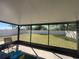 A backyard with a screened in lanai offers a private place to relax in the shade at 1249 Oak Valley Dr, Auburndale, FL 33823