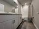 Stylish bathroom with a white vanity, modern fixtures, and a shower-tub combination for convenience at 1249 Oak Valley Dr, Auburndale, FL 33823