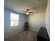 Cozy bedroom features a ceiling fan, neutral walls, and a bright window, perfect for relaxation at 1249 Oak Valley Dr, Auburndale, FL 33823